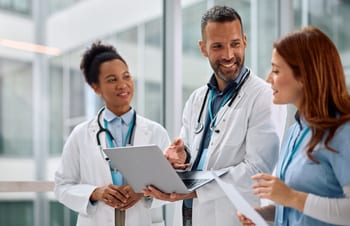 Clinicians reviewing a report