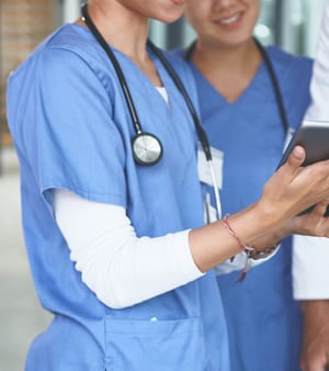 Doctors and students discussing feedback
